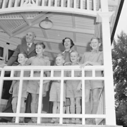 Tresca boys with the Warden, Harry Richmond, and his wife on the verandah